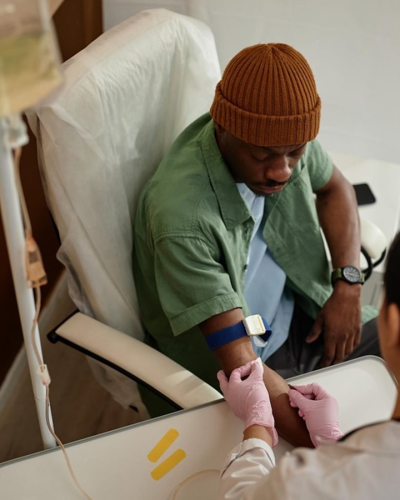 black-man-preparing-iv-treatment-clinic_236854-58470
